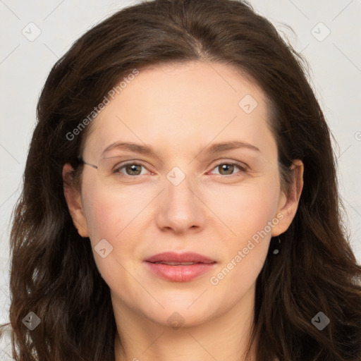 Joyful white adult female with long  brown hair and brown eyes