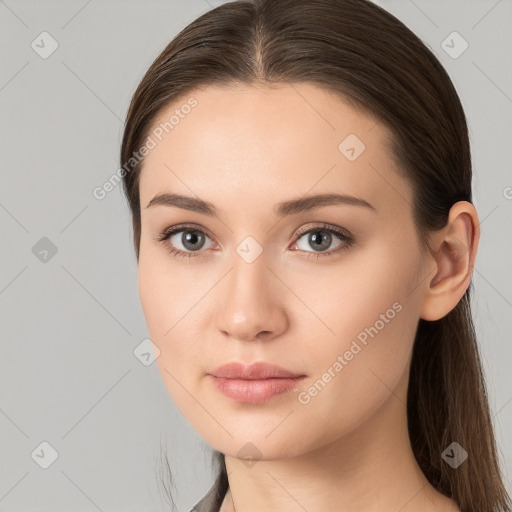 Neutral white young-adult female with long  brown hair and brown eyes