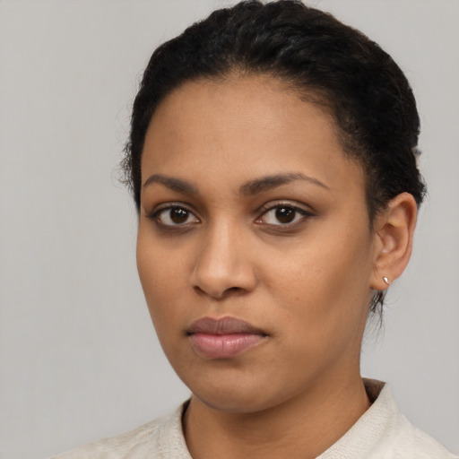 Neutral latino young-adult female with short  black hair and brown eyes