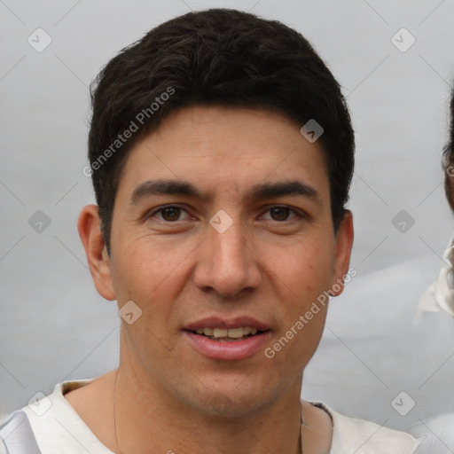 Joyful white young-adult male with short  black hair and brown eyes