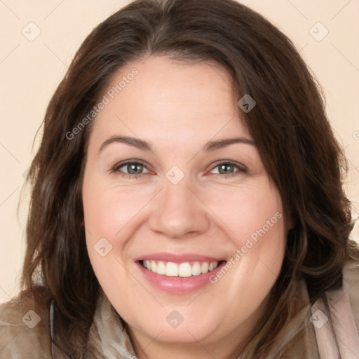 Joyful white adult female with long  brown hair and brown eyes