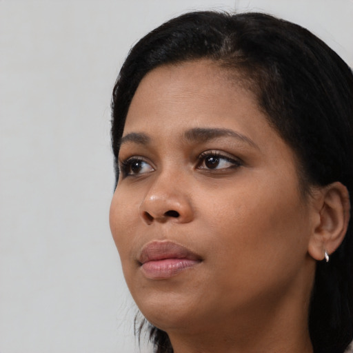 Neutral black young-adult female with short  black hair and brown eyes