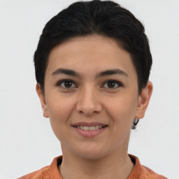 Joyful asian young-adult female with short  brown hair and brown eyes