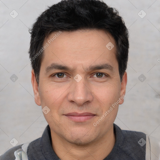 Joyful white adult male with short  black hair and brown eyes