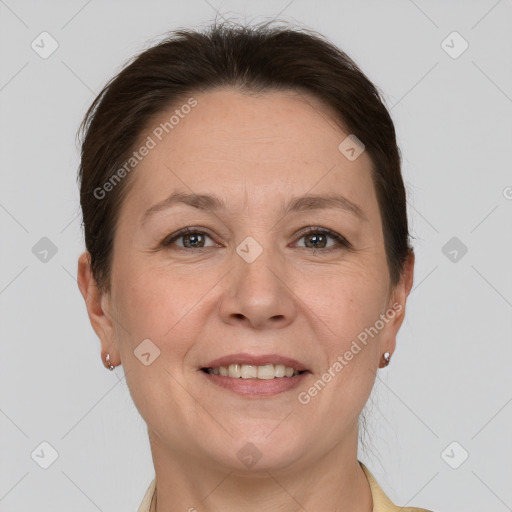 Joyful white adult female with short  brown hair and grey eyes