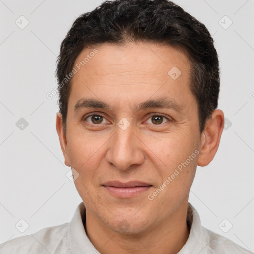 Joyful white adult male with short  brown hair and brown eyes