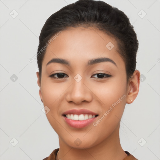 Joyful latino young-adult female with short  brown hair and brown eyes