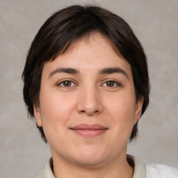 Joyful white young-adult female with medium  brown hair and brown eyes