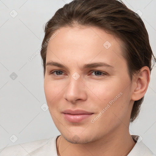 Joyful white young-adult female with short  brown hair and brown eyes