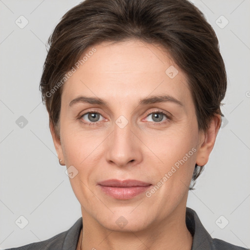 Joyful white adult female with short  brown hair and grey eyes