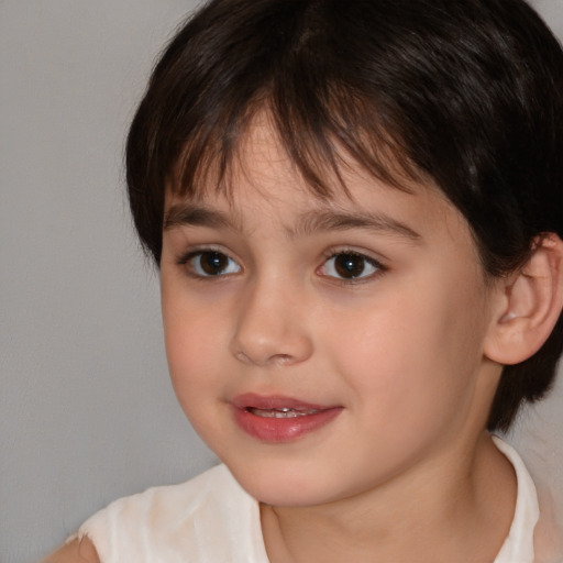 Joyful white child female with medium  brown hair and brown eyes