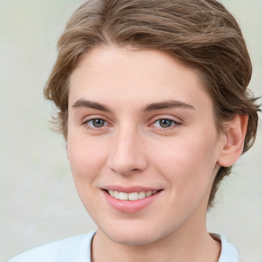 Joyful white young-adult female with medium  brown hair and green eyes