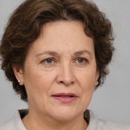 Joyful white middle-aged female with short  brown hair and brown eyes