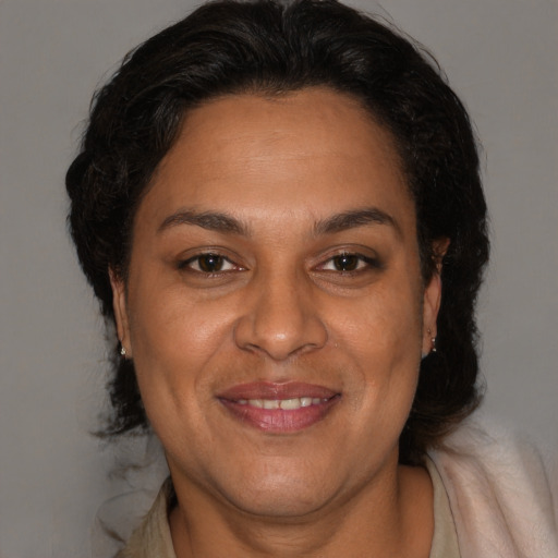 Joyful white adult female with medium  brown hair and brown eyes