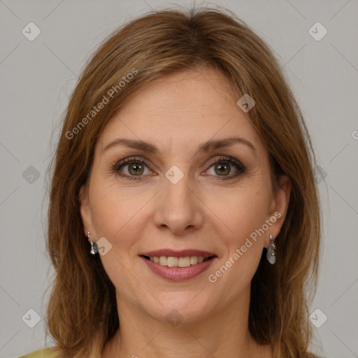 Joyful white young-adult female with long  brown hair and green eyes