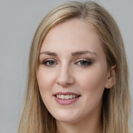 Joyful white young-adult female with long  brown hair and grey eyes