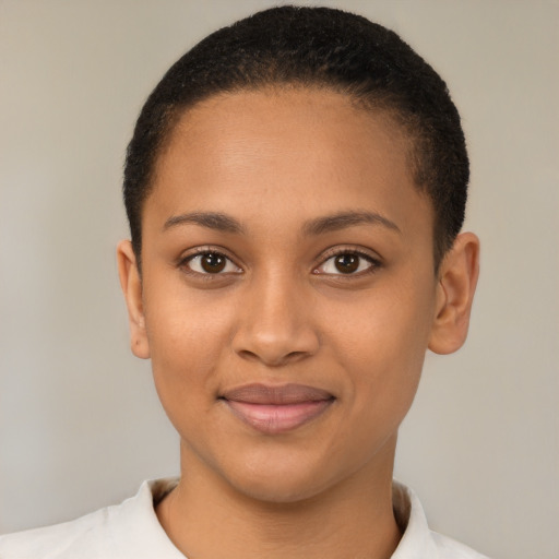 Joyful latino young-adult female with short  brown hair and brown eyes