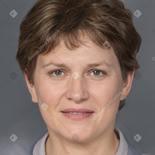 Joyful white adult female with short  brown hair and grey eyes