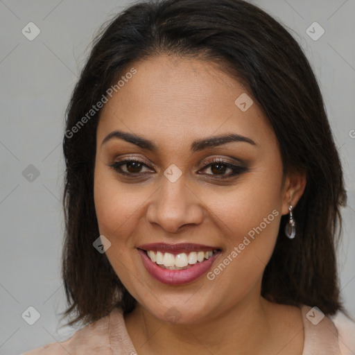 Joyful latino young-adult female with medium  brown hair and brown eyes