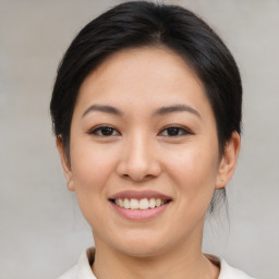 Joyful asian young-adult female with medium  brown hair and brown eyes