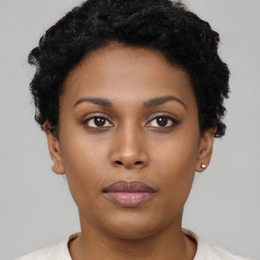 Neutral black young-adult female with short  black hair and brown eyes