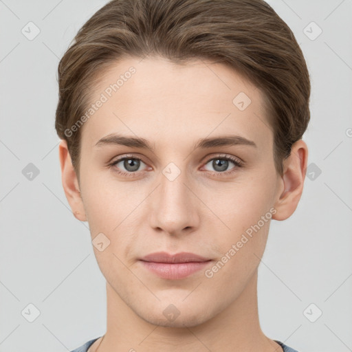 Joyful white young-adult female with short  brown hair and grey eyes