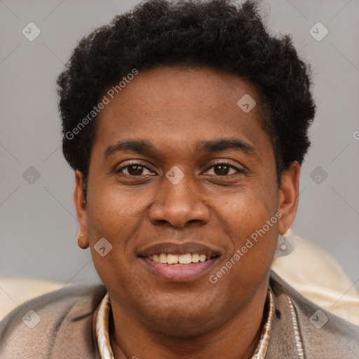 Joyful black young-adult male with short  brown hair and brown eyes