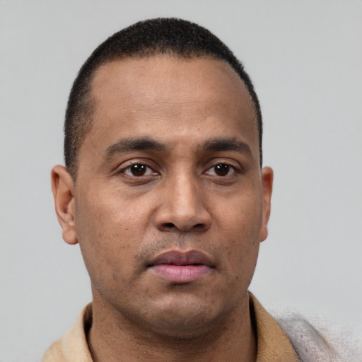 Neutral latino young-adult male with short  brown hair and brown eyes