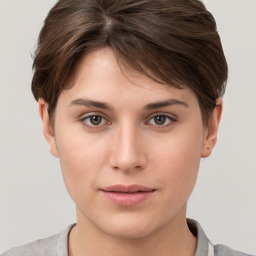 Neutral white young-adult female with short  brown hair and brown eyes