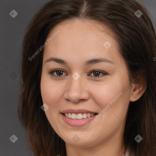 Joyful white young-adult female with long  brown hair and brown eyes