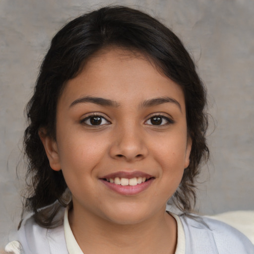 Joyful latino child female with medium  brown hair and brown eyes