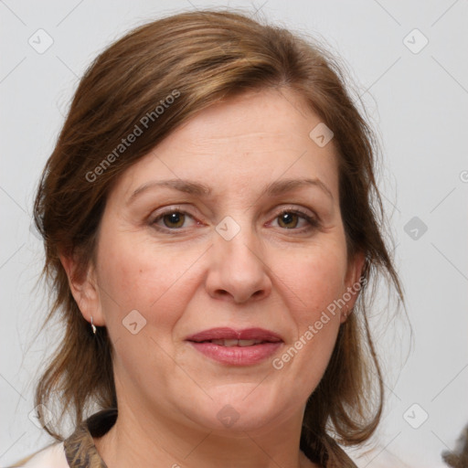 Joyful white adult female with medium  brown hair and grey eyes