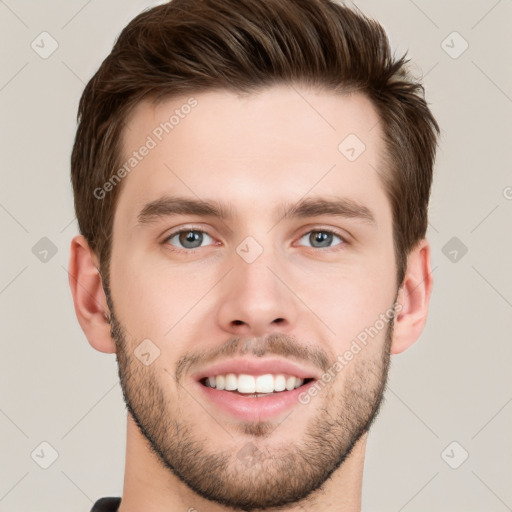 Joyful white young-adult male with short  brown hair and grey eyes