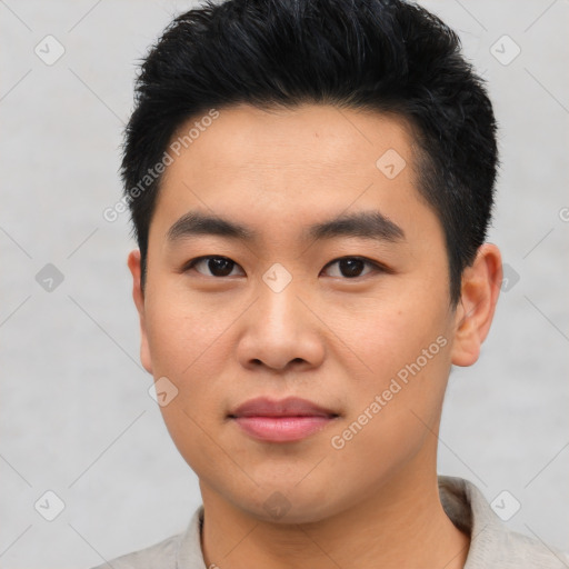 Joyful asian young-adult male with short  black hair and brown eyes