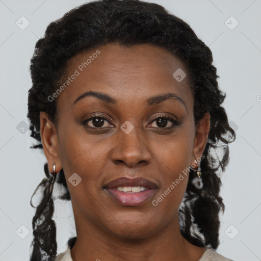 Joyful black adult female with short  brown hair and brown eyes