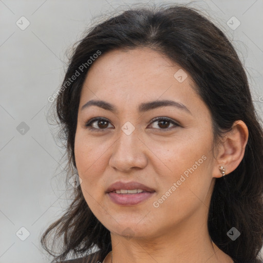 Joyful white adult female with long  brown hair and brown eyes