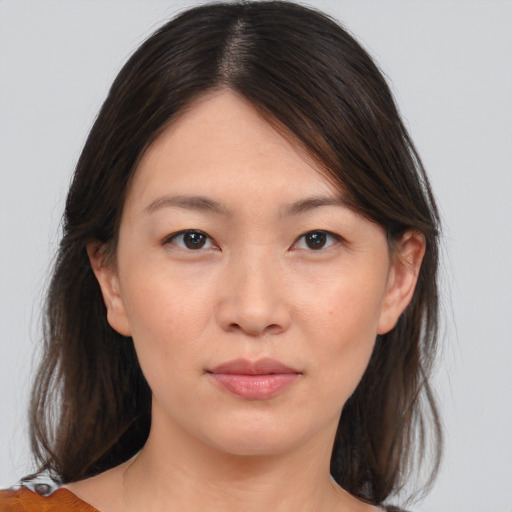 Neutral asian young-adult female with medium  brown hair and brown eyes