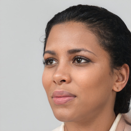 Neutral black young-adult female with medium  black hair and brown eyes