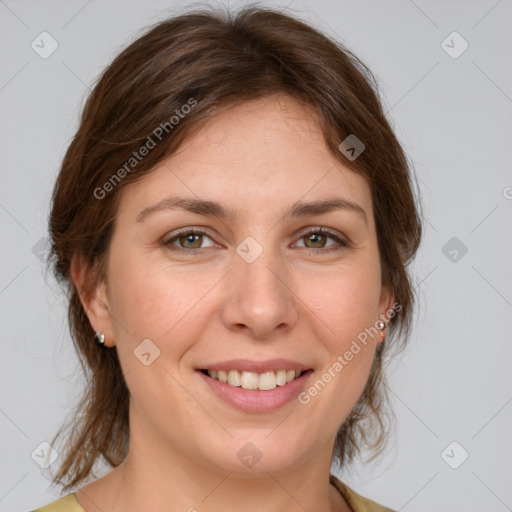 Joyful white young-adult female with medium  brown hair and green eyes