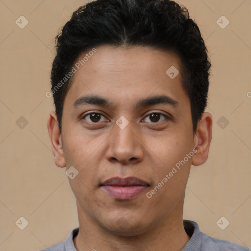 Joyful latino young-adult male with short  brown hair and brown eyes