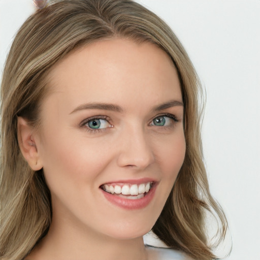 Joyful white young-adult female with long  brown hair and blue eyes