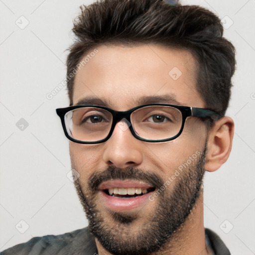 Joyful white young-adult male with short  black hair and brown eyes