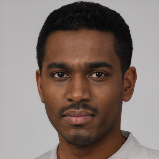 Neutral black young-adult male with short  black hair and brown eyes