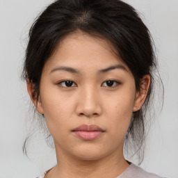 Neutral asian young-adult female with medium  brown hair and brown eyes