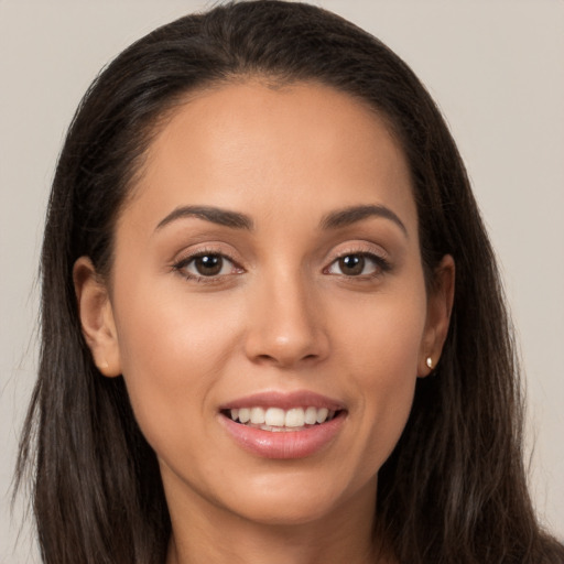 Joyful white young-adult female with long  brown hair and brown eyes