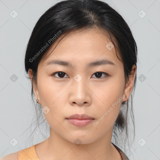 Neutral asian young-adult female with medium  brown hair and brown eyes