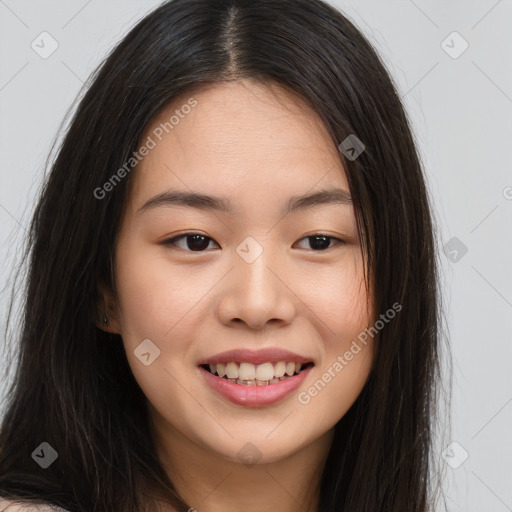 Joyful asian young-adult female with long  brown hair and brown eyes