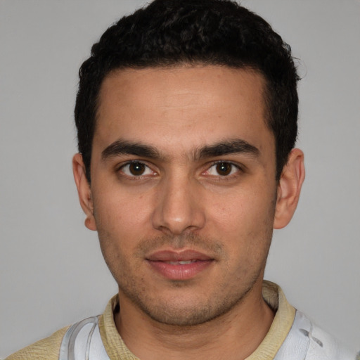 Neutral white young-adult male with short  black hair and brown eyes