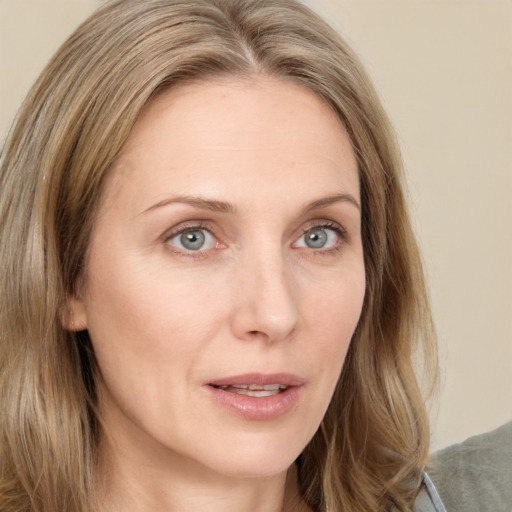 Neutral white young-adult female with long  brown hair and green eyes