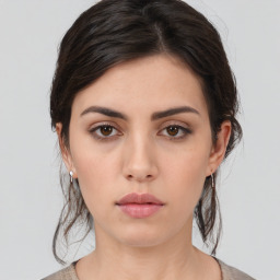 Neutral white young-adult female with medium  brown hair and brown eyes